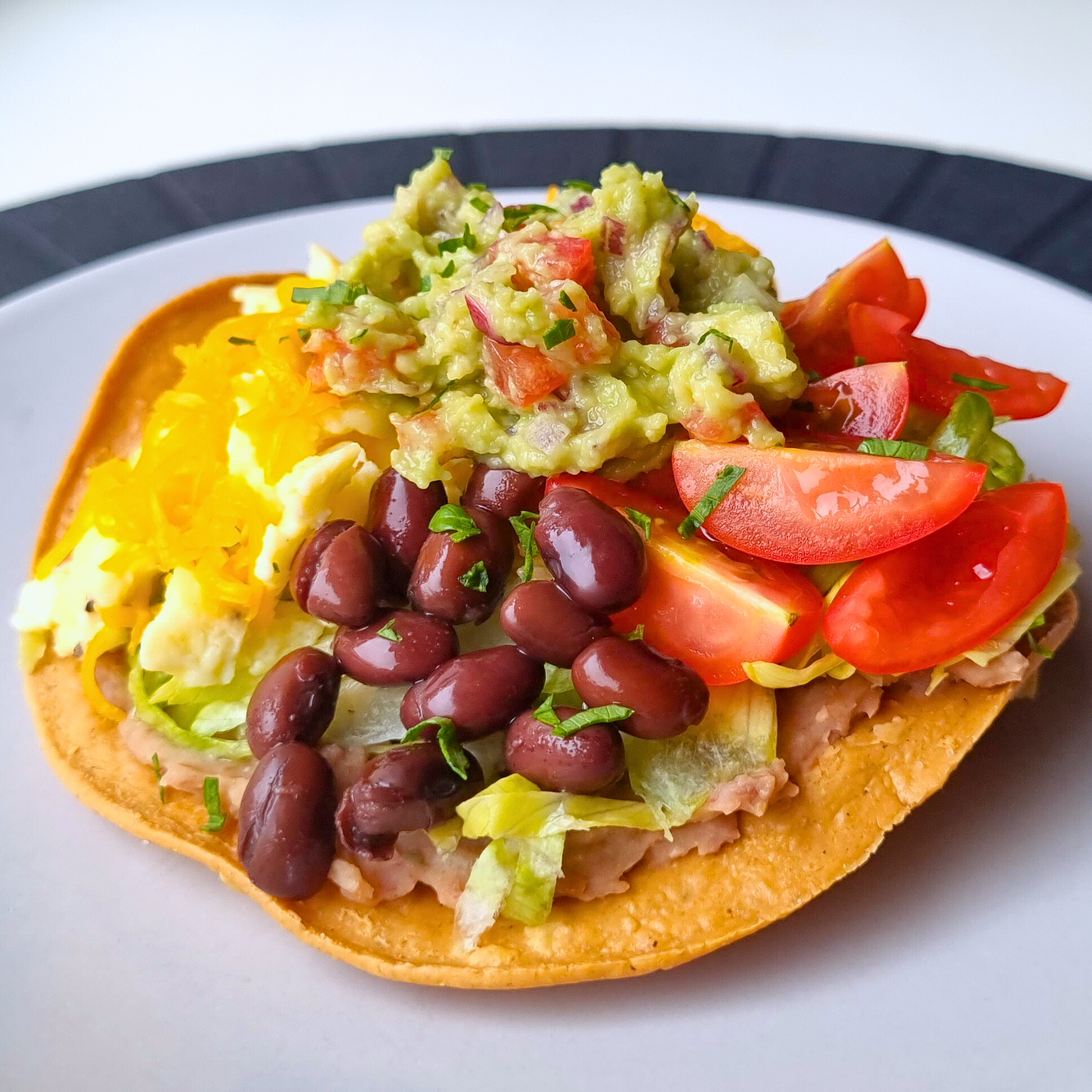 Breakfast tostada refried beans, scrambled eggs & cheddar – eiwitrijk