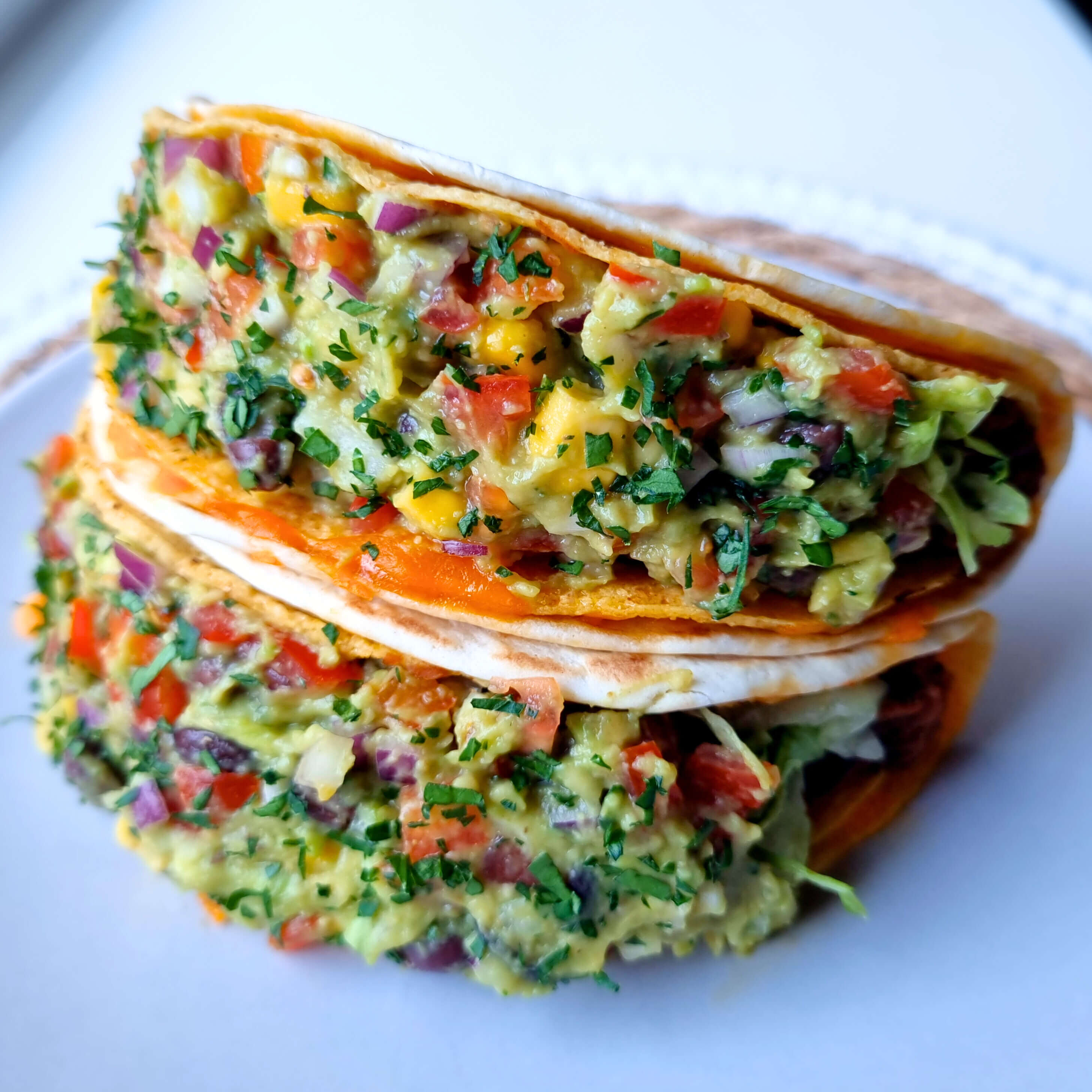 Gordita crunch met cheddar, Tex-Mex zwarte bonen & loaded guacamole